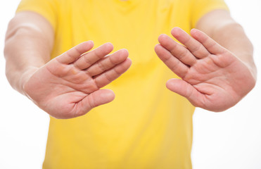 Young man demonstrating prohibiting of a gesture