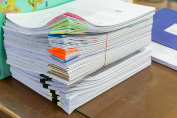 Stack of business papers on office desk