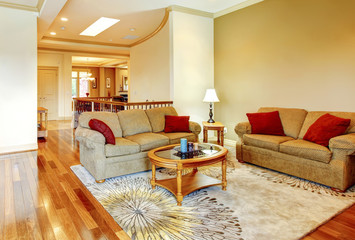 Fototapeta na wymiar Bright brown and red living room interior with hardwood floor, n