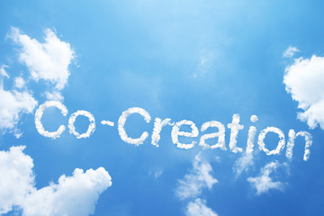 "Co-Creation" cloud word on sky.