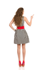 Long Haired Woman Pointing Rear View