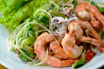sunflower sprout with prawn and squid spicy salad on dish
