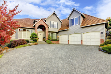 Large beautiful Classic ninties home exterior with cedar roof  i