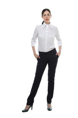 the portrait of standing young adult beautiful brunette slender woman wearing on white shirt and black trousers gesturing isolated on white background
