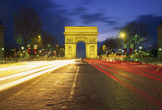 Arc de Triomphe illuminated at dusk, Paris, France