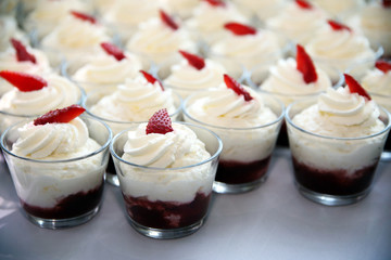 Whipped cream with chocolate on table in row