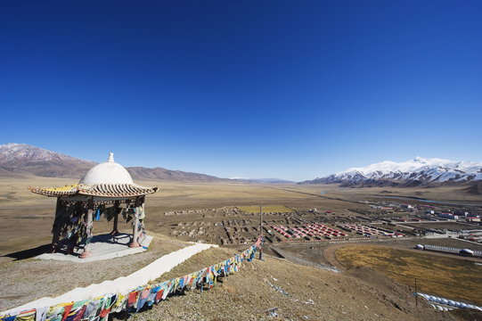 Prayer flags and sacred site overlooking the town of Bayanbulak, Xinjiang Province, China