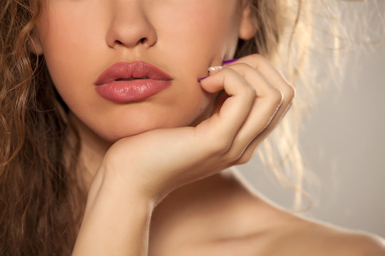 female lips, hand, nose and shoulder