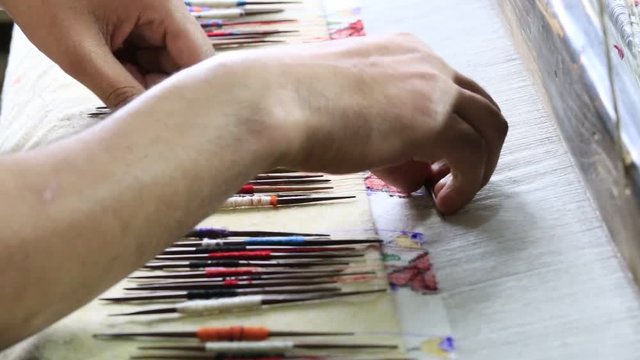 Indian local man makes a Pashmina Shawl the traditional way in Srinagar, Kashmir province. India