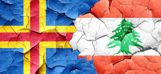 aland islands with Lebanon flag on a grunge cracked wall