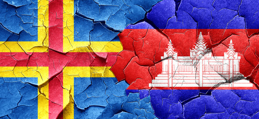 aland islands with Cambodia flag on a grunge cracked wall