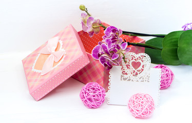 gift box and flowers of orchids and card for text