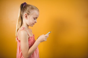Girl with a ponytail with a smartphone