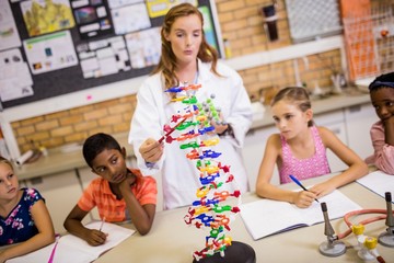 Teacher giving lesson to her students