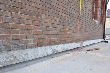 New construction waterproofing basement walls from outside. 
