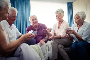 Fototapeta premium Group of seniors playing cards