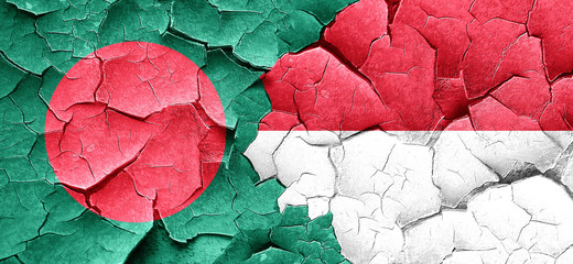 Bangladesh flag with Indonesia flag on a grunge cracked wall