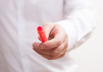 Businessman offering marker