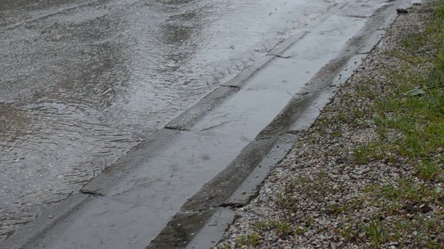 Water flows along the road during rain