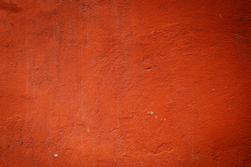 red weathered plaster wall background