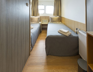 Interior of a cabin bedroom on cruise boat hotel