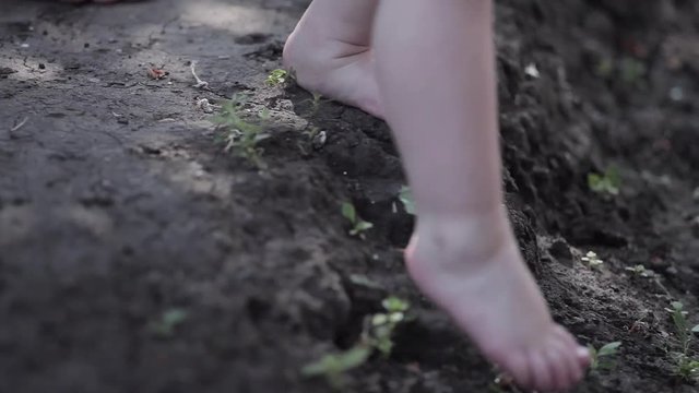 Baby Feets Makes First Walking Barefoot on the Ground