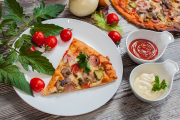  pizza  with mushrooms and pepperoni , tomatoes