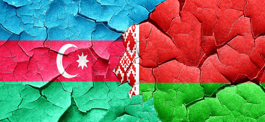 Azerbaijan flag with Belarus flag on a grunge cracked wall