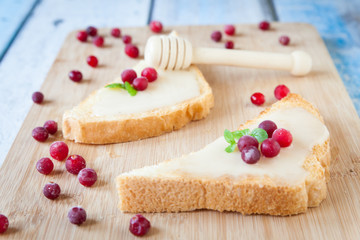 Sandwiches with cream honey and cranberries