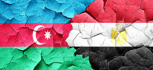 Azerbaijan flag with egypt flag on a grunge cracked wall