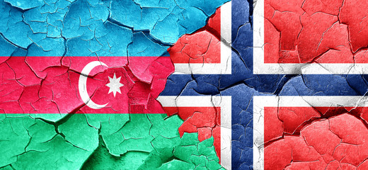 Azerbaijan flag with Norway flag on a grunge cracked wall