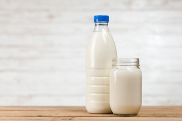 Milk bottle on wooden table