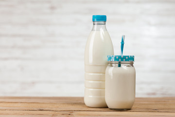 Milk bottle on wooden table