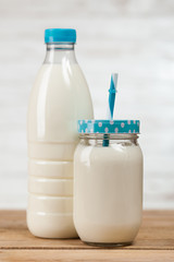 Milk bottle on wooden table