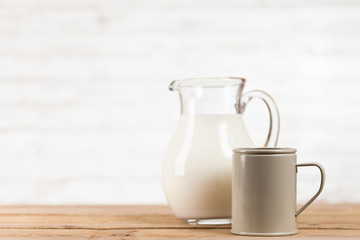 Milk jar on wooden table
