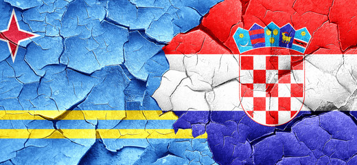 aruba flag with Croatia flag on a grunge cracked wall