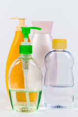 Colored glamour plastic bottles isolated on white background