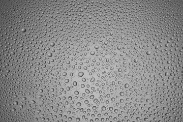 Background from drops of different size on steel-color glass