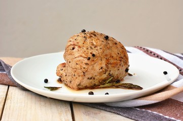 Rosted pork meat tenderloin with black pepper and rosemary on wood prepared to cook