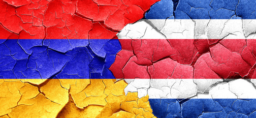 Armenia flag with Costa Rica flag on a grunge cracked wall