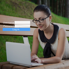 account registration concept - girl using laptop lying on bench