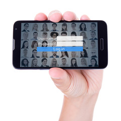social network login concept - mobile smart phone in hand isolat