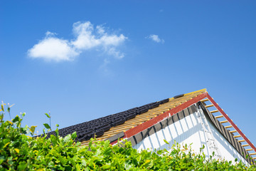 Roof renovation with black tiles