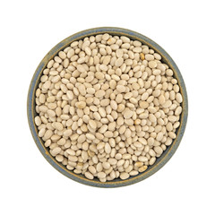 Full bowl of organic navy beans isolated on a white background top view.