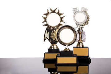 Group of gold medal trophy on white background