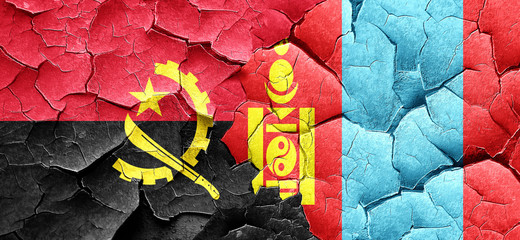 Angola flag with Mongolia flag on a grunge cracked wall