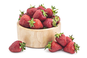 Fresh raw organic strawberries in wooden bowl on a white background