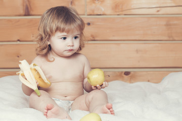 Fototapeta premium Boy with banana and apples