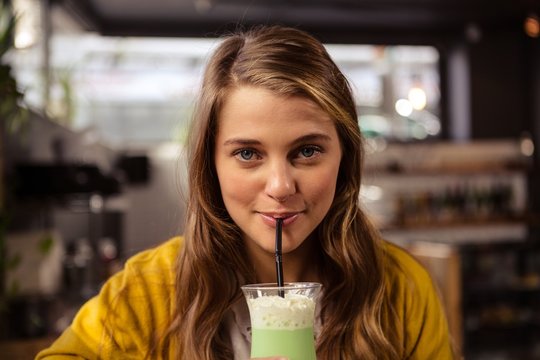 Casual Woman Drinking A Cocktail