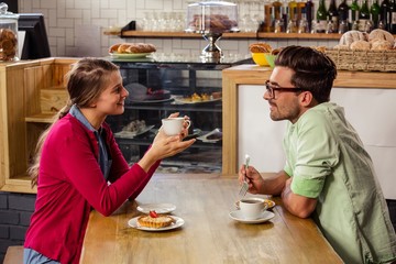 Couple sitting at table and talking